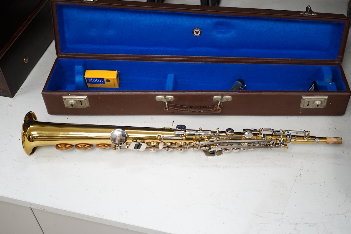A cased Sonora soprano saxophone in a Rudall Carte branded case